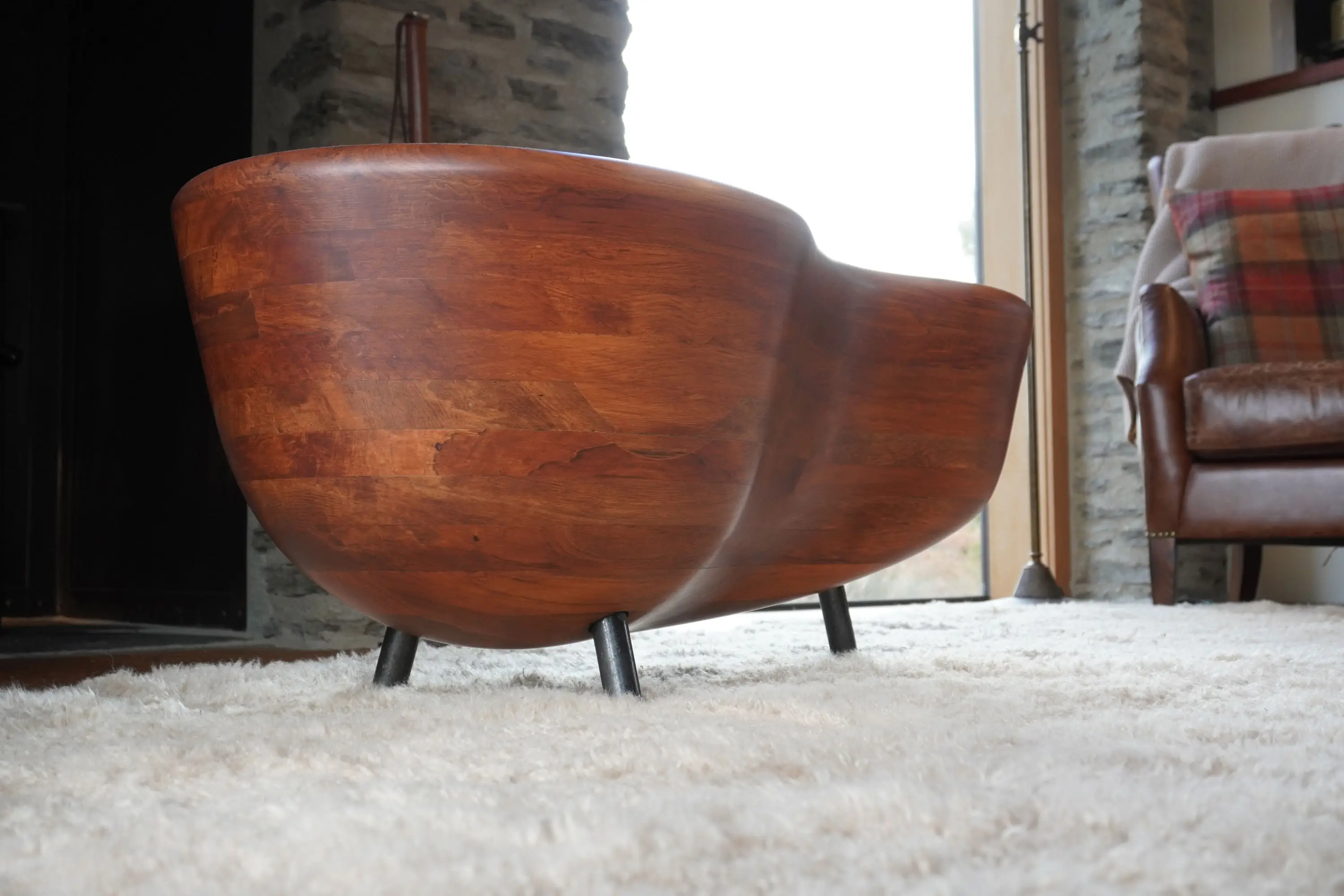 Hand-carved curves and natural grain detail of Rimu solid timber coffee table