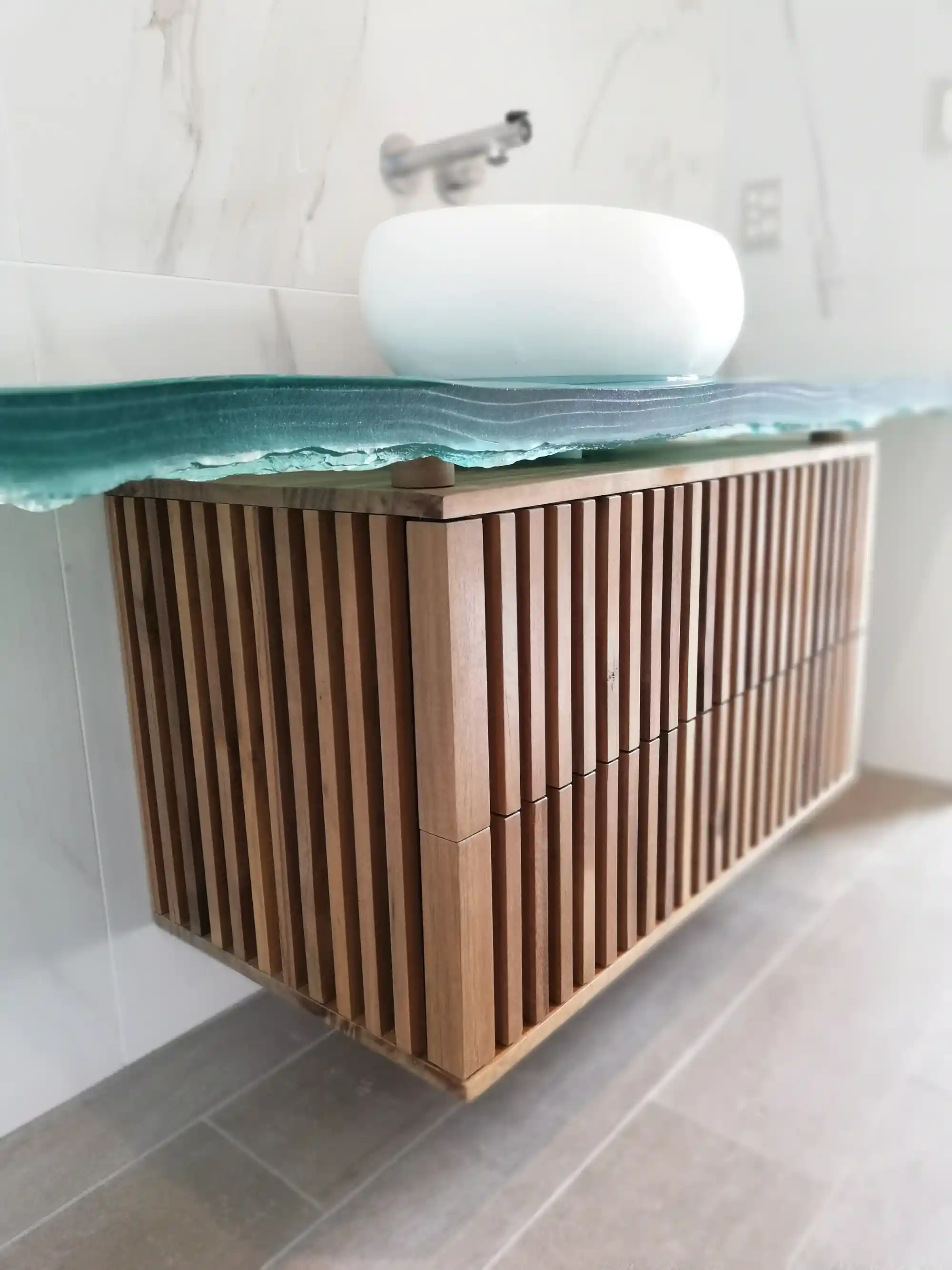 Handcrafted timber vanity with sculptural glass top