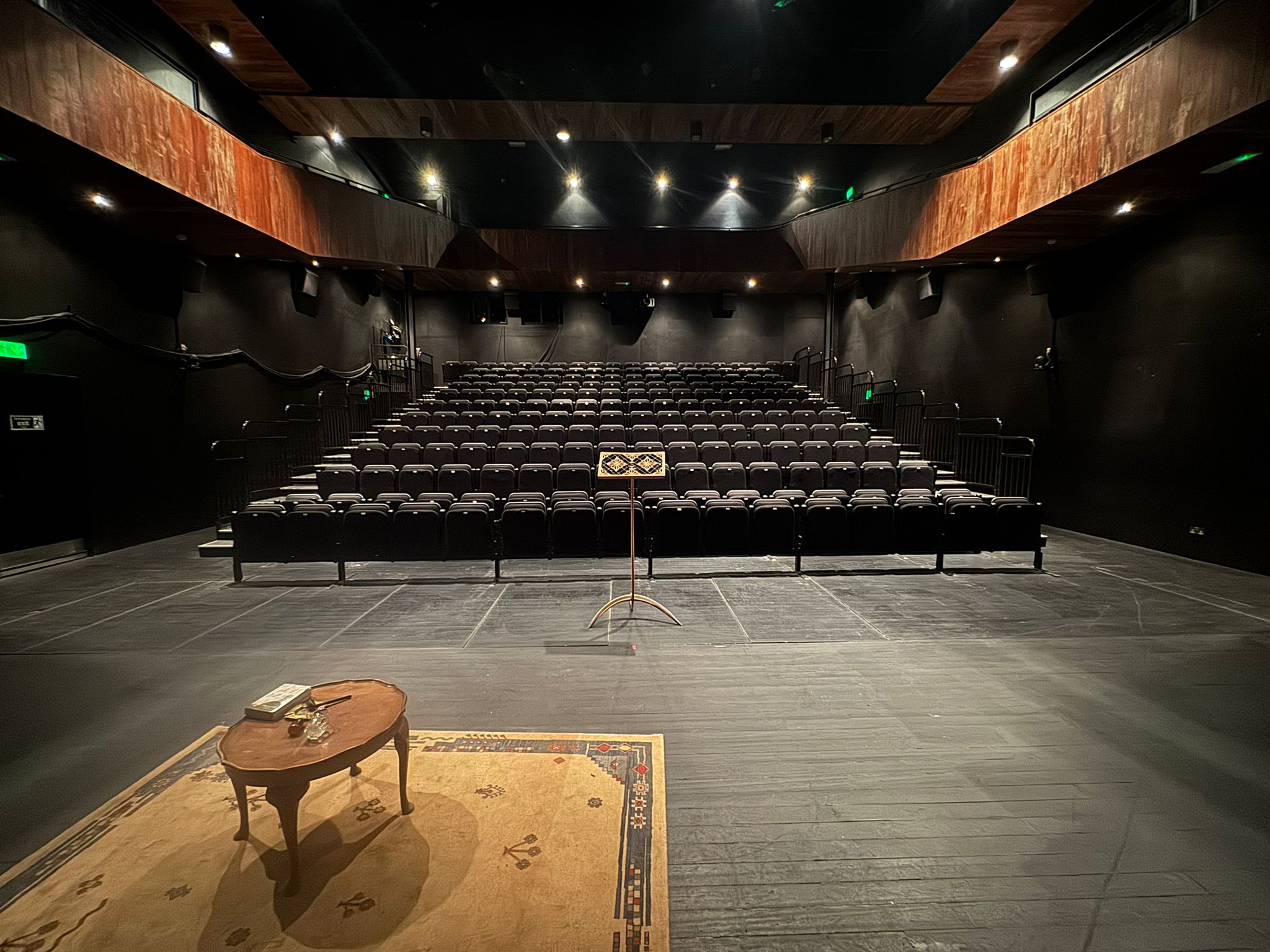 Handcrafted timber lectern designed to enhance public speaking placed at an empty auditorium